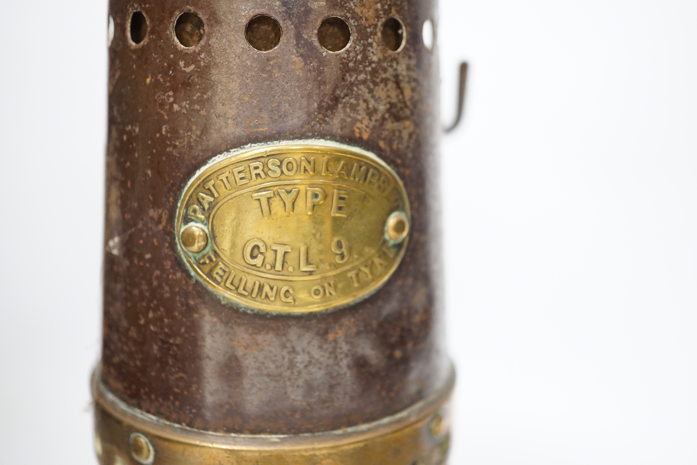 A Patterson type GTL9 miner's lamp and two aneroid barometers, one by Ross, London, 26cm